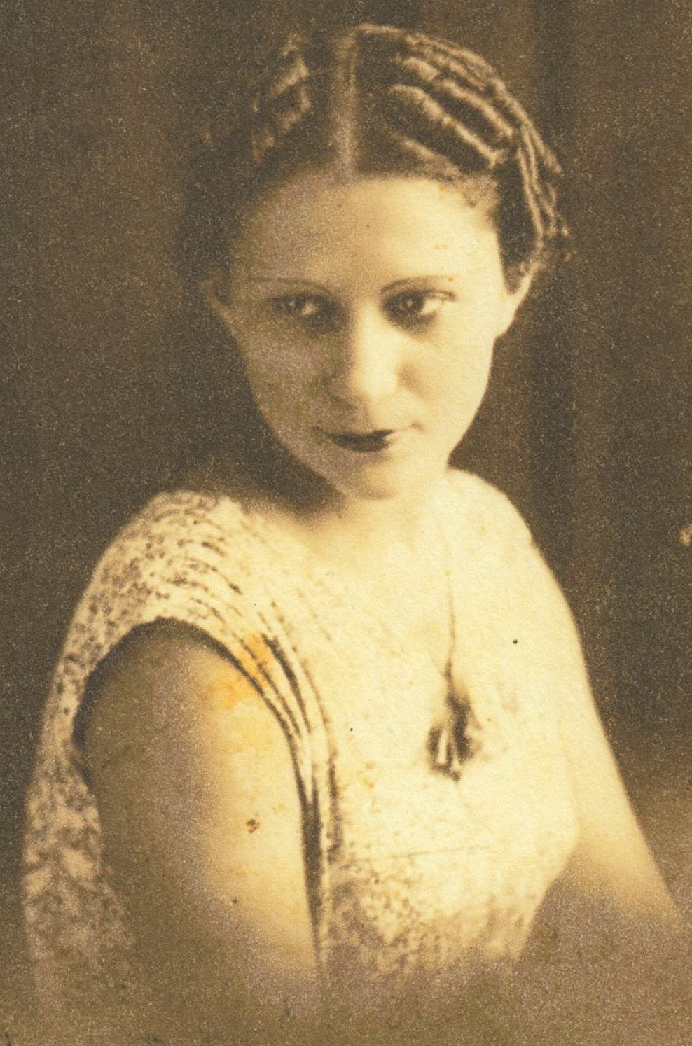 A sepia-toned headshot of Julia de Burgos